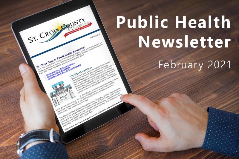 A person reading the St. Croix County Public Health Newsletter on a digital tablet.