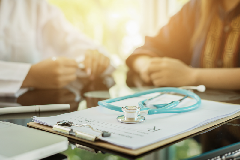 A doctor talking with a patient.