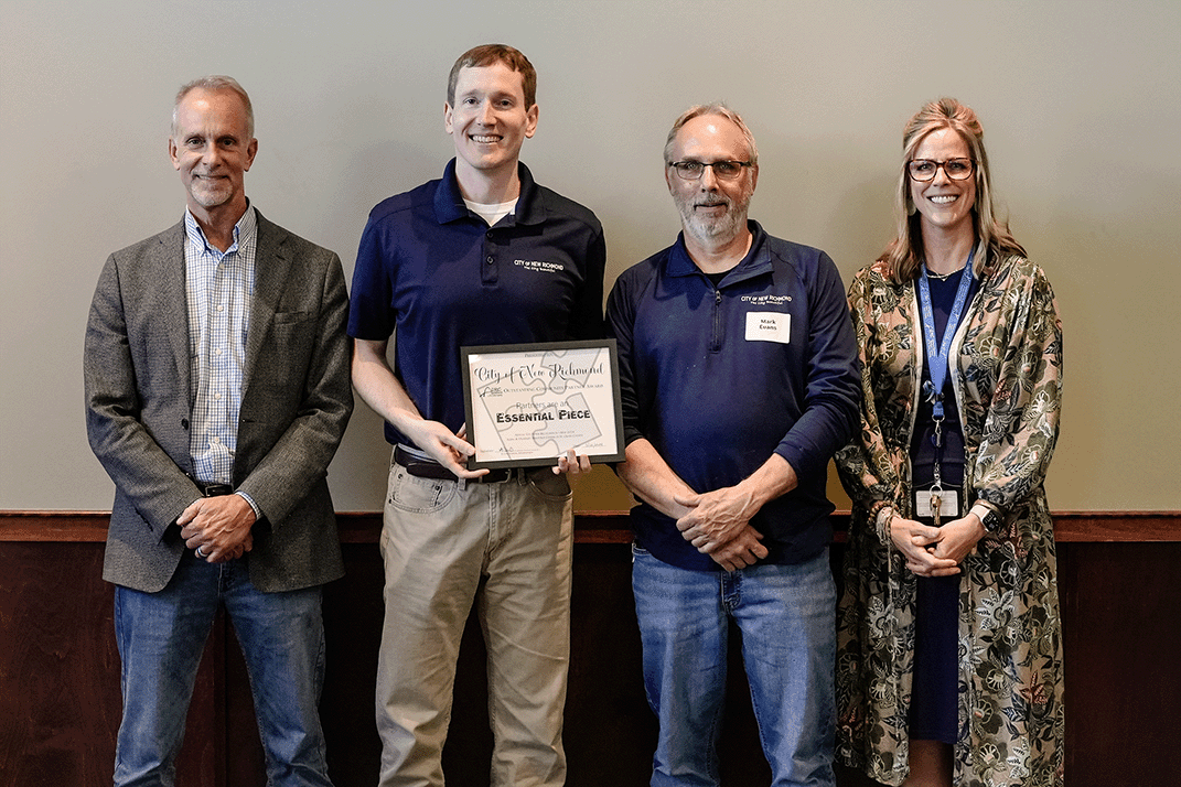 Bob and Kristin pictured with Noah and Mark from the city of New Richmond at the volunteer banquet.